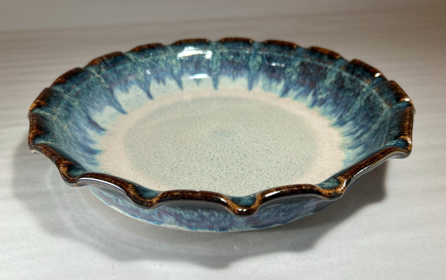 Stoneware Pie Plate Deep dish with fluted edge.