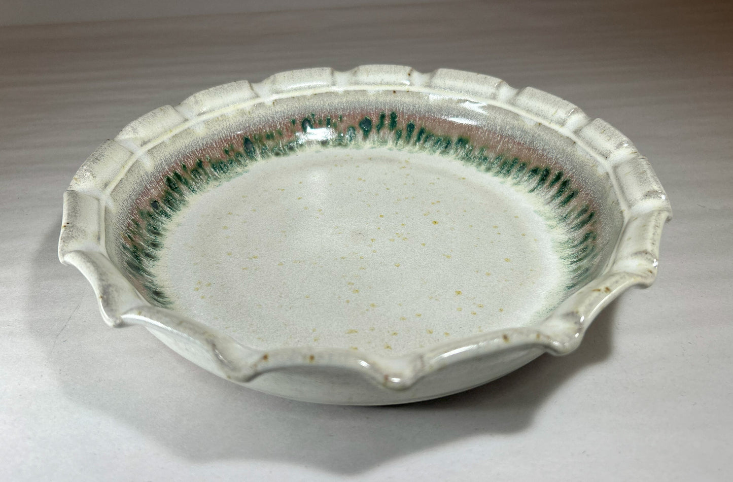 Stoneware Pie Plate Deep dish with fluted edge.