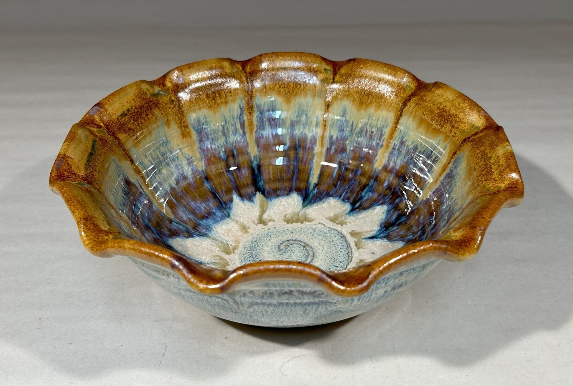 Handmade pottery bowl with fluted edge