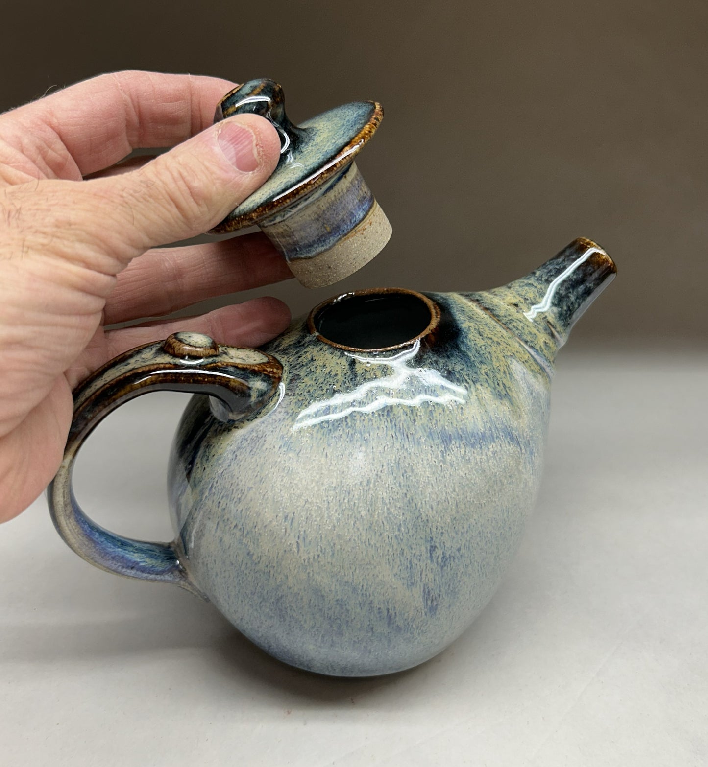 Small Handmade pottery teapot finished in a beautiful Rutile Blue & Temoku Glaze