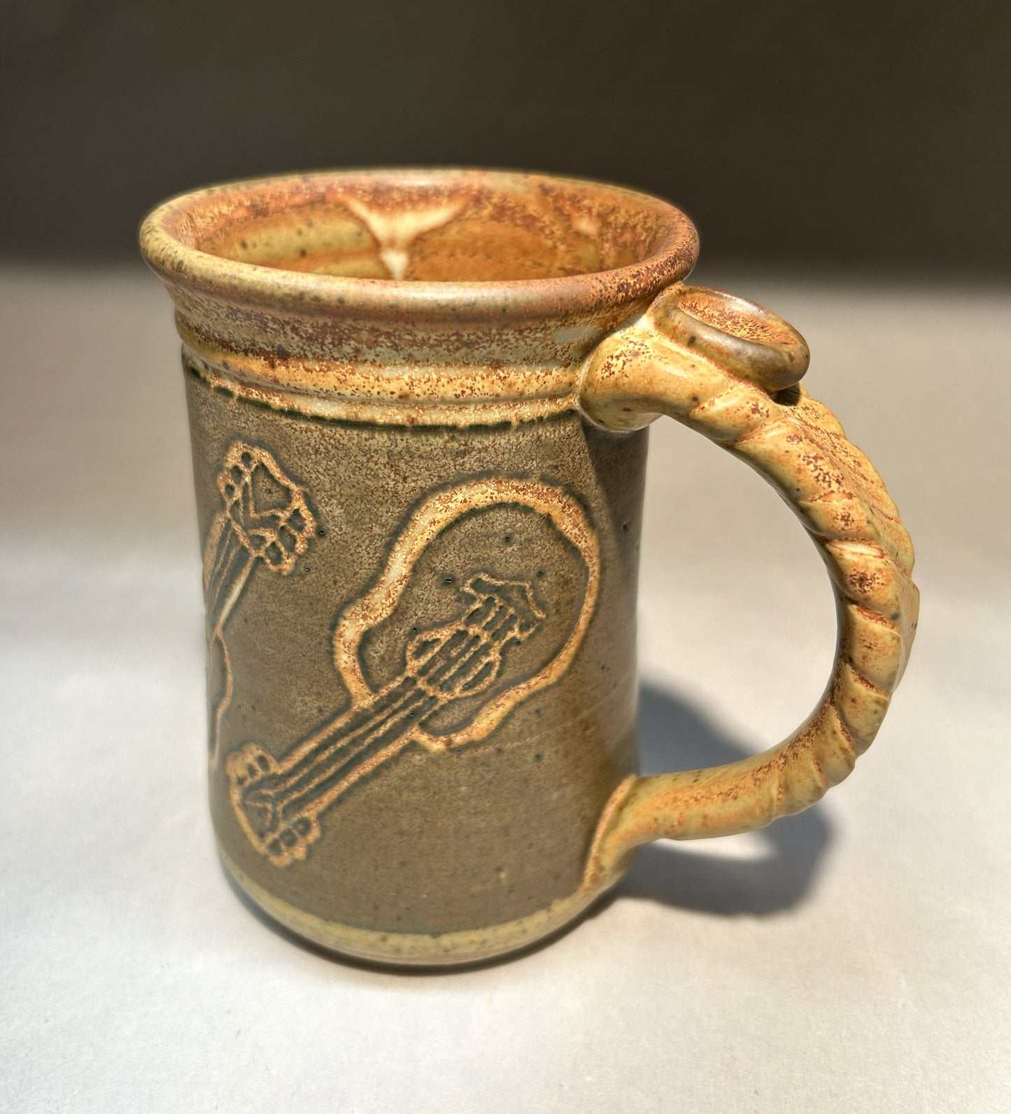 Handmade Pottery Mug with Carved Guitar Underglaze Design
