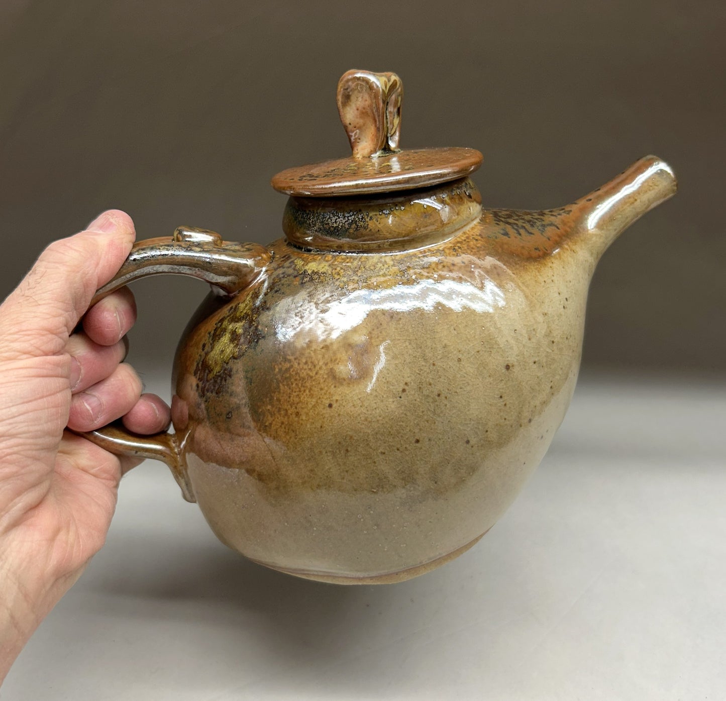 Handmade pottery teapot finished in a beautiful Shino glaze