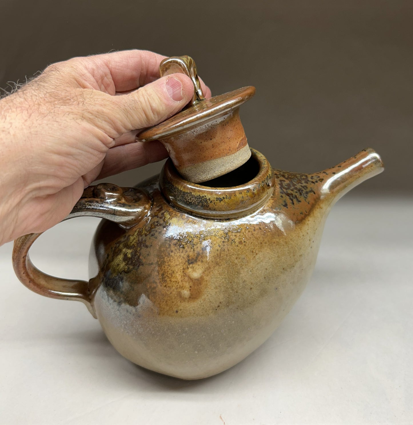 Handmade pottery teapot finished in a beautiful Shino glaze