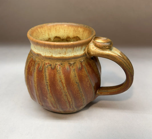 Faceted Pottery mug with Shanner red glaze