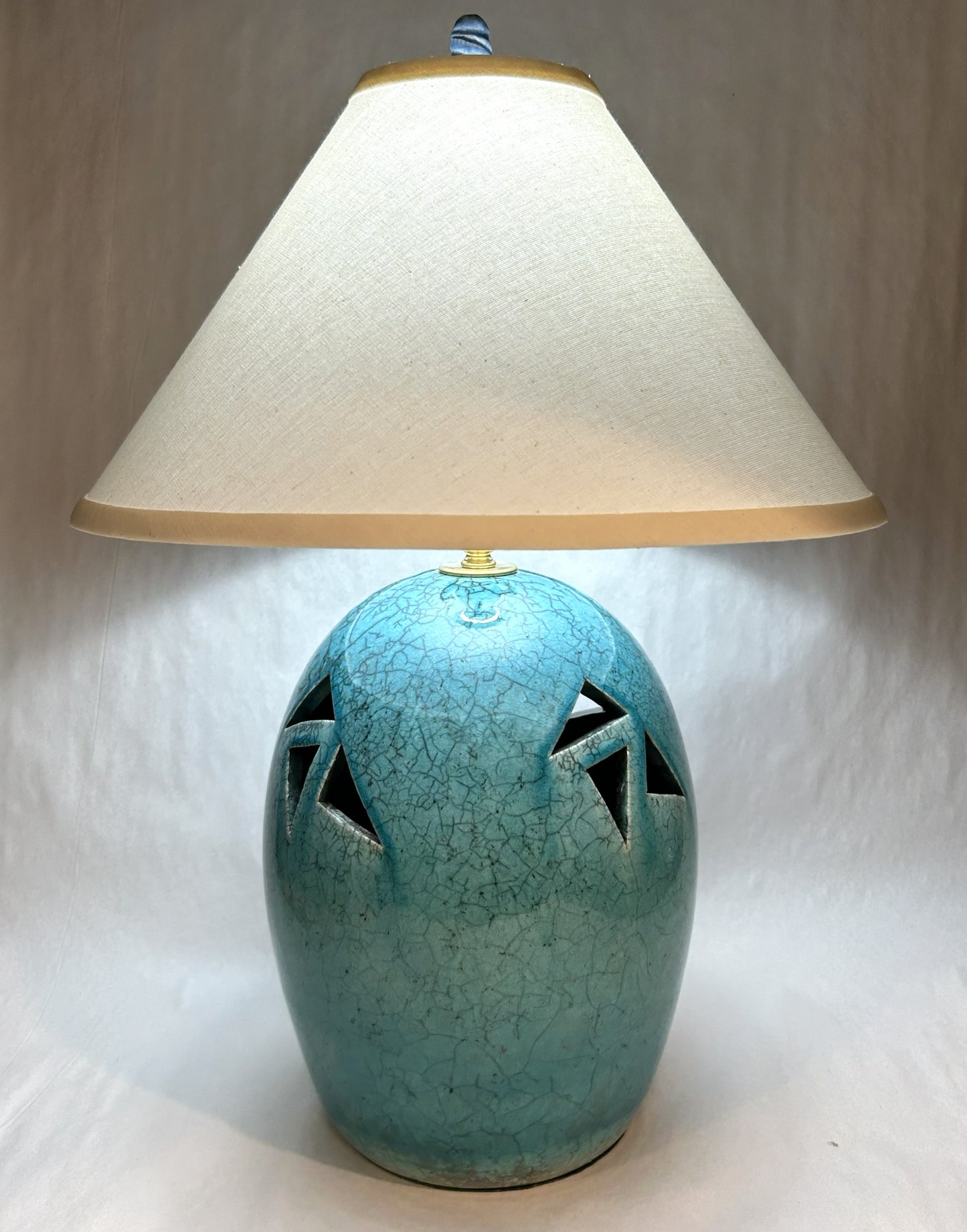 Handmade Raku Pottery Lamp with Light Blue Raku Glaze and a handmade finial