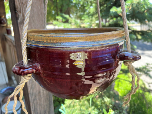 Hanging pottery planter